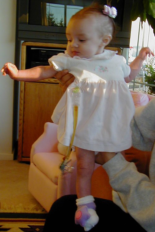Genevieve's new dress and her hair in pig-tails.