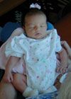 Genevieve being held by her Great-Grandmother Liz